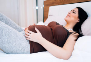 Болит между ног при беременности 30 недель